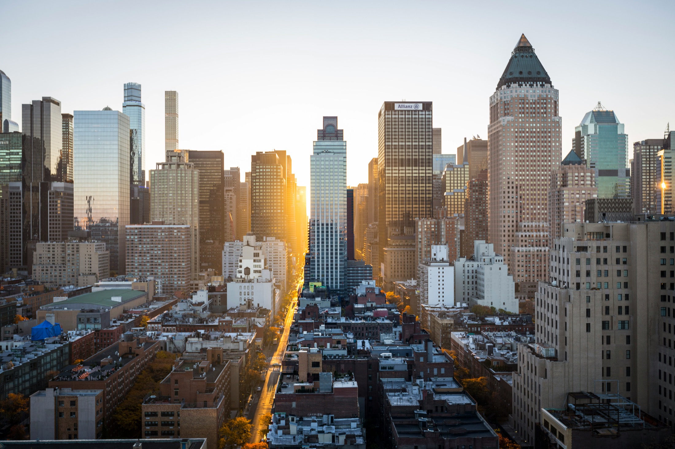Sunlight falling between the towers of the Manhattan skyline